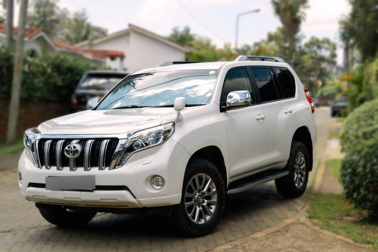 Toyota Land Cruiser Prado TX, front three-quarter on a Nairobi street