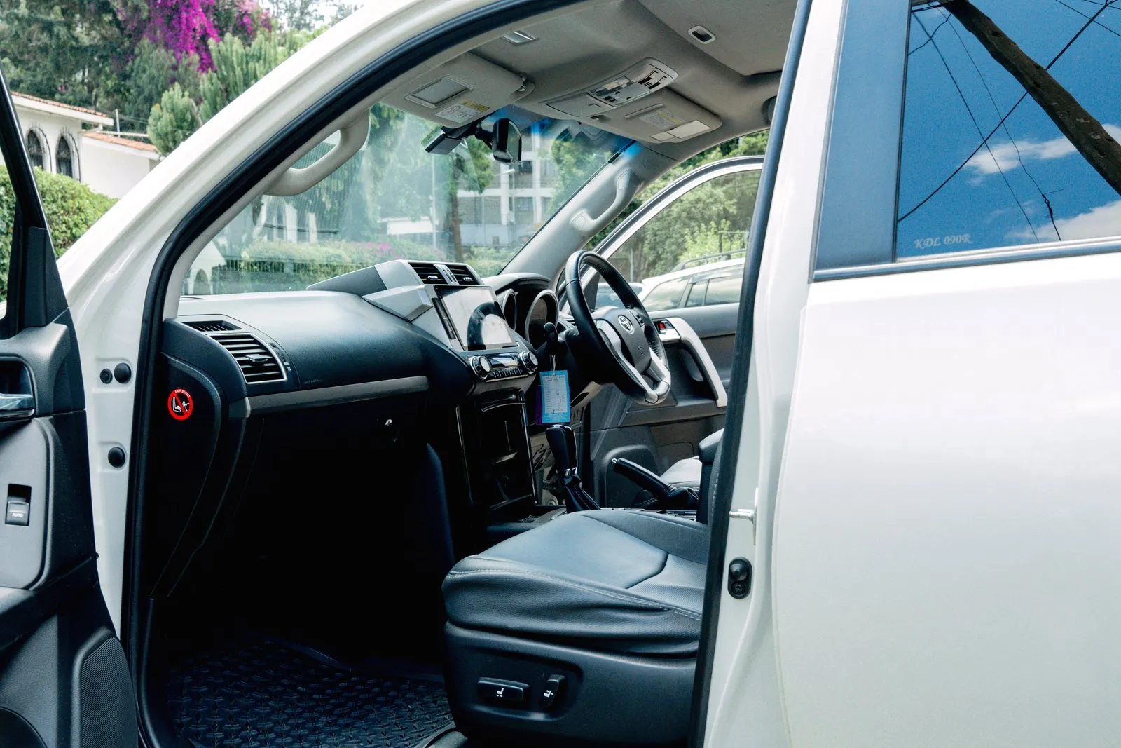 Prado front seats in leather, seen from the open door
